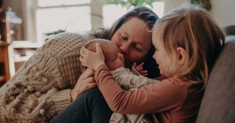adult and child with baby