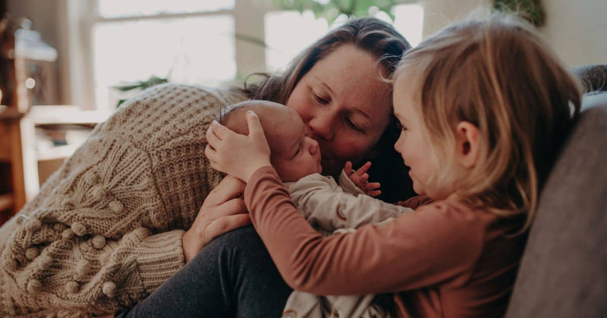 adult and child with baby